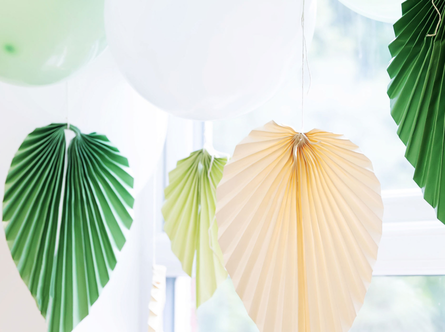 Paper decorations and eco balloons in sage, green, cream and white.