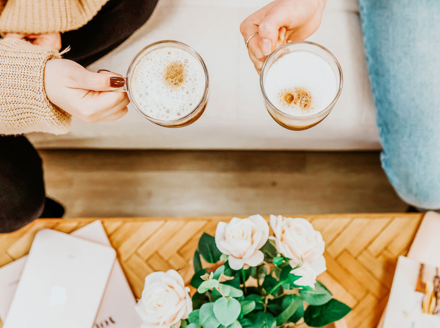 Friends sharing coffee at The Createry