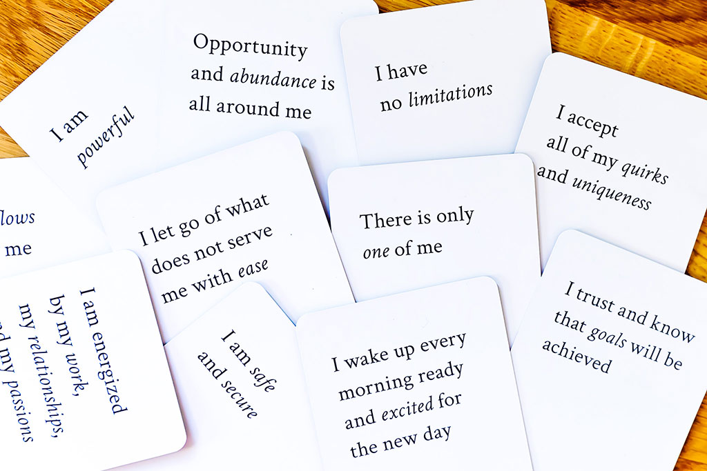 White cards with black quotes on them.