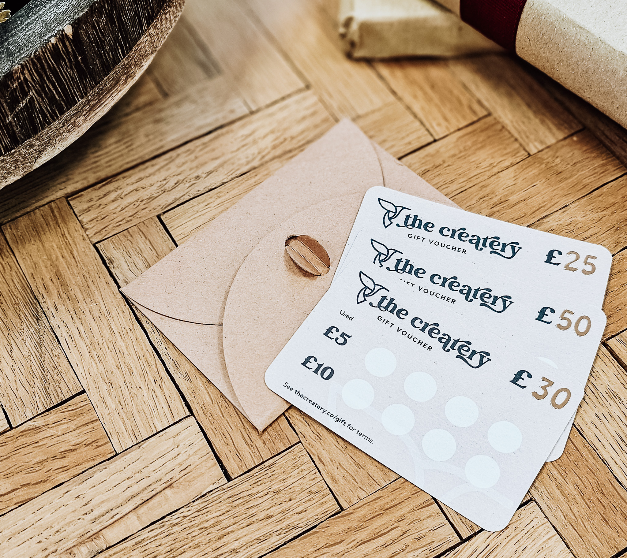 Createry gift cards on wooden table
