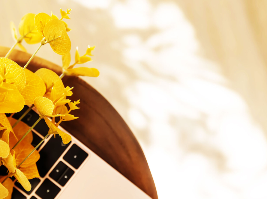 Laptop on table with flowers
