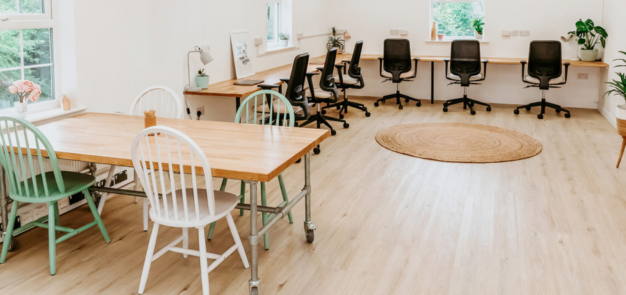 Tables and chairs in the coworking space.